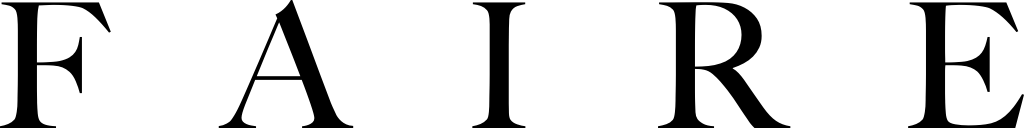 A shop owner smiling in a well-curated, vibrant store