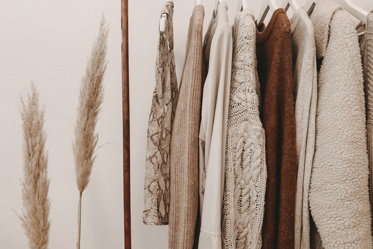 Boutique retailer arranging curated products on shelves