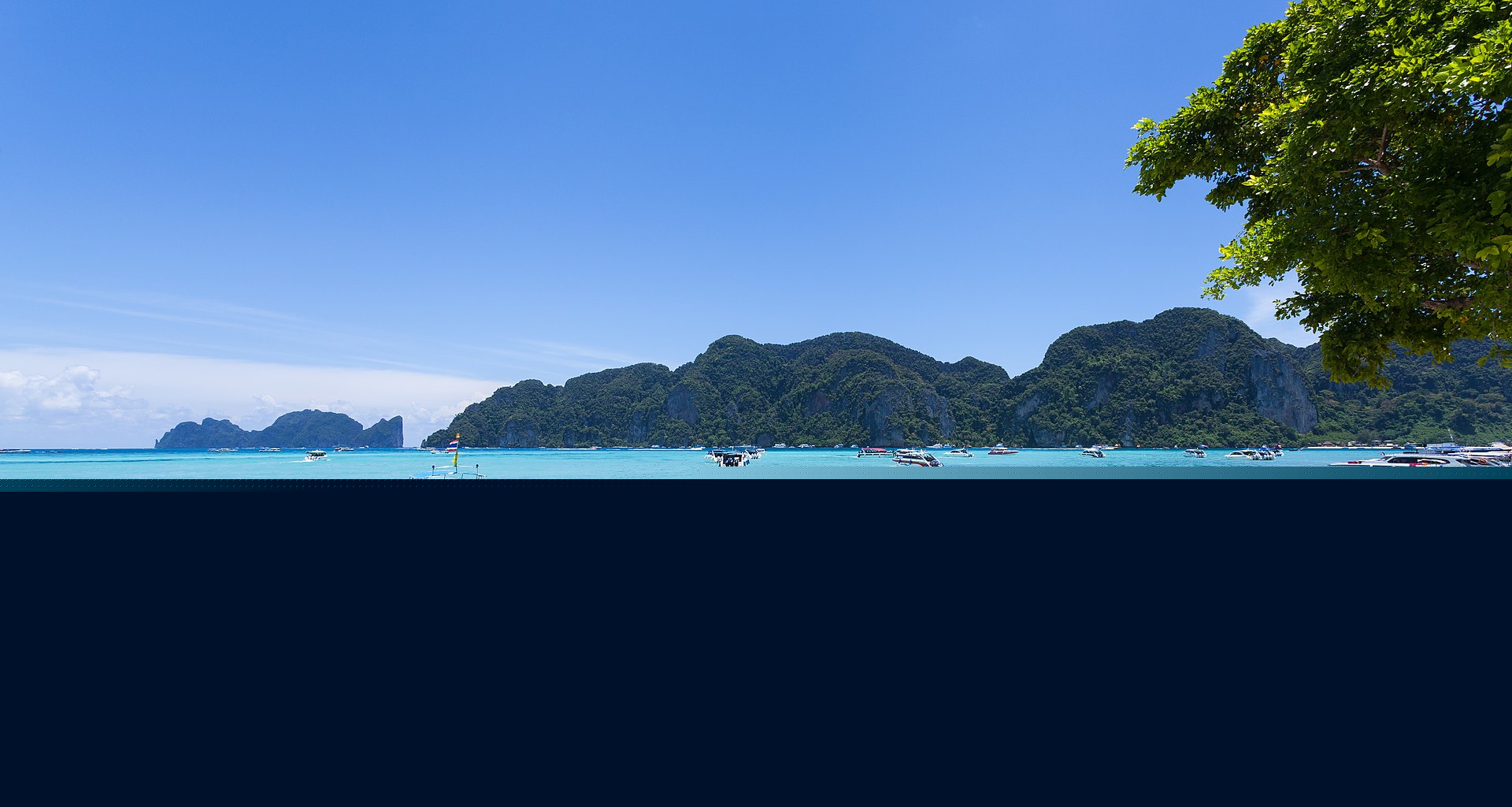 Ko Phi Phi beach in Thailand with longtail boats, a Klook day-tour destination