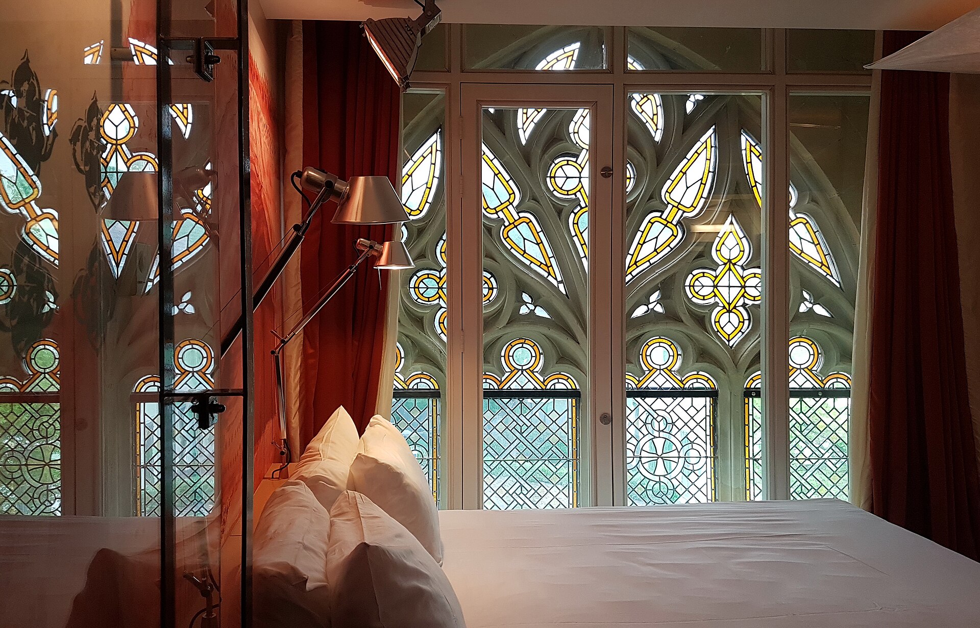 Modern boutique hotel room with a made bed, the kind of property compared across booking sites on trivago