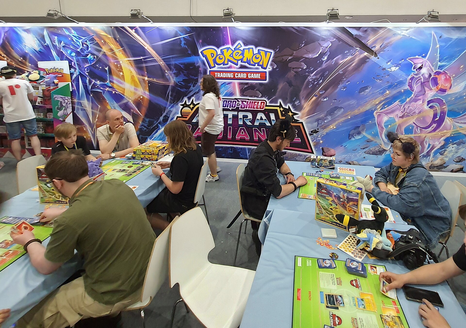 Collectors browsing Pokémon trading cards at a gaming event, the community Whatnot's live auctions grew from